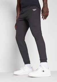 Reebok IDENTITY SMALL LOGO JOGGER - Donji dijelovi trenirke - black