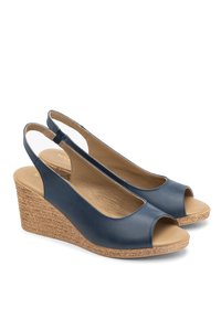 Tumesinine nahast vahekingad avatud varvastega, slingback disain ja punutud jute konts. Sile tekstuur loodusliku viimistlusega.