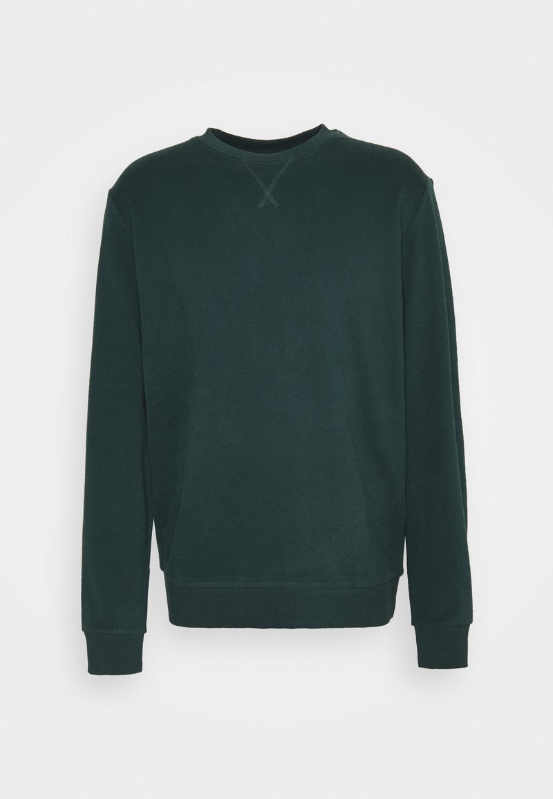 Sweatshirt vert foncé à col rond en tissu doux. Il possède des manches longues, des poignets côtelés et un design simple, sans embellissements.