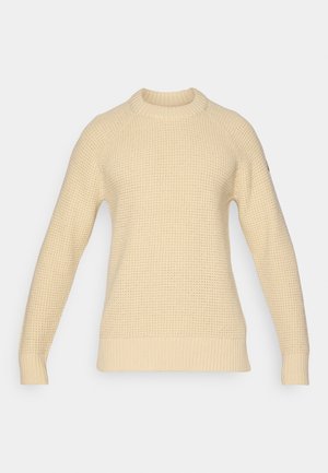 Gebreide trui in lichtbeige, met een geribbelde ronde halslijn, lange raglanmouwen en een gestructureerd patroon door het hele stuk.