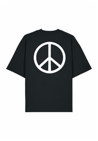 T-shirt noir à manches courtes avec un grand symbole de paix blanc centré sur le devant.