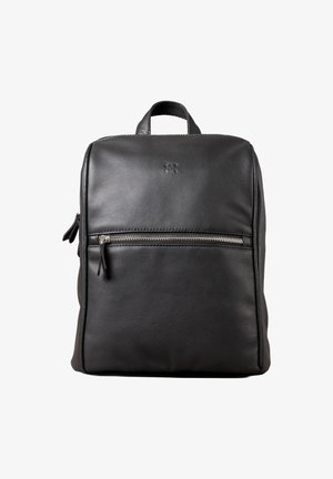 Black leather backpack with a smooth texture, square shape, top handle, and front zip pocket. Features minimalist design and subtle logo detail.