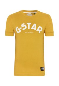 Geel katoenen t-shirt met een ronde hals, korte mouwen en opvallende witte "G-STAR" tekst met een label aan de zoom.