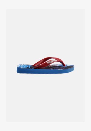 Sinine sõrmik sandaal punaste rihmade ja valge "havaianas" tekstiga, kus on jalanõu tallal koomiksiteemaline disain, valgel taustal.