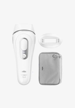 Appareil d'épilation Braun Silk-expert Pro 3 en blanc, au design épuré, avec une coque de protection grise et un petit accessoire de filtre lumineux ovale.