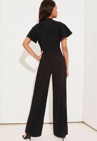 Lipsy FLUTTER SLEEVE V NECK TIE FRONT WIDE LEG - Kezeslábas - black