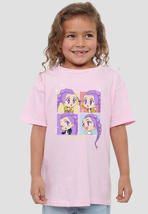 Light pink cotton t-shirt featuring four colorful animated character illustrations with purple hair and large eyes. Boxed backgrounds in pastel colors.