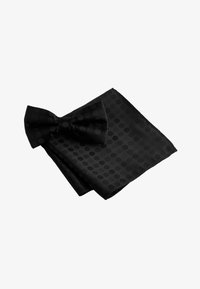 Selected, black polka dot