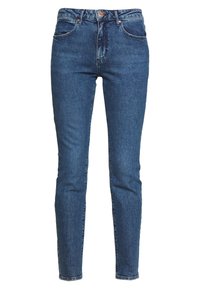 Tajta jeans i mörkblå denim. Hög midja med fem fickor. Har kopparnitar och tonalt broderi. Räta fram.