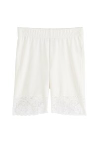 Hvide shorts lavet af blødt stof, med blonderkant forneden. Taljen er elastisk, hvilket giver en behagelig pasform.