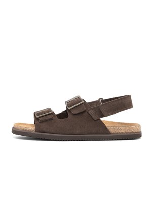 Brown suede sandal with two adjustable buckles over the foot and a back strap, featuring a cork footbed and rubber sole.