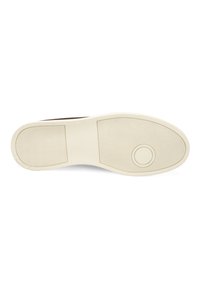 Sneaker-Sohle aus strukturiertem beigem Gummi, mit Rillen für besseren Halt und einem kreisförmigen Emblem in der Mitte. Glatte Kanten entlang des Umfangs.