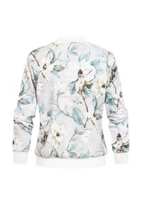 Veste blanche à manches longues avec imprimé floral bleu clair et beige, poignets et ourlet côtelés, vue de dos sur un fond blanc.