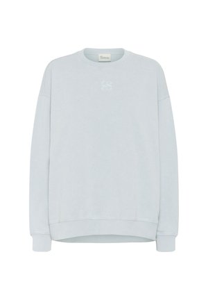 Light blue sweatshirt made of soft fabric, featuring a crew neckline, dropped shoulders, and a subtle embroidered logo on the chest.