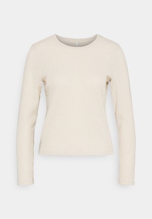 Langärmliges, geripptes Shirt in Creme mit rundem Halsausschnitt und figurbetonter Silhouette. Weicher, strukturierter Stoff mit vertikalen Streifen.