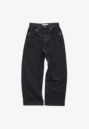Black denim pants with a loose fit, featuring five pockets, metal button and rivets, and rolled cuffs for a casual look.