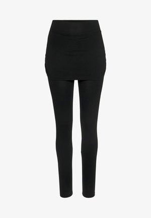 Schwarze Leggings mit einem angenähten schwarzen Minirock. Der Stoff ist dehnbar und hat eine glatte Textur. Verfügt über einen breiten, elastischen Bund.