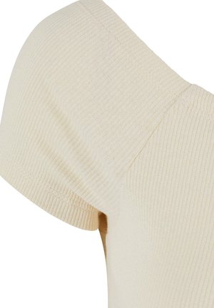 Kremasta rebrasta pletenina, ki se ponaša z obliko kratkih rokavov in širokega ovratnika. Gladka tekstura z oprijetim krojem.