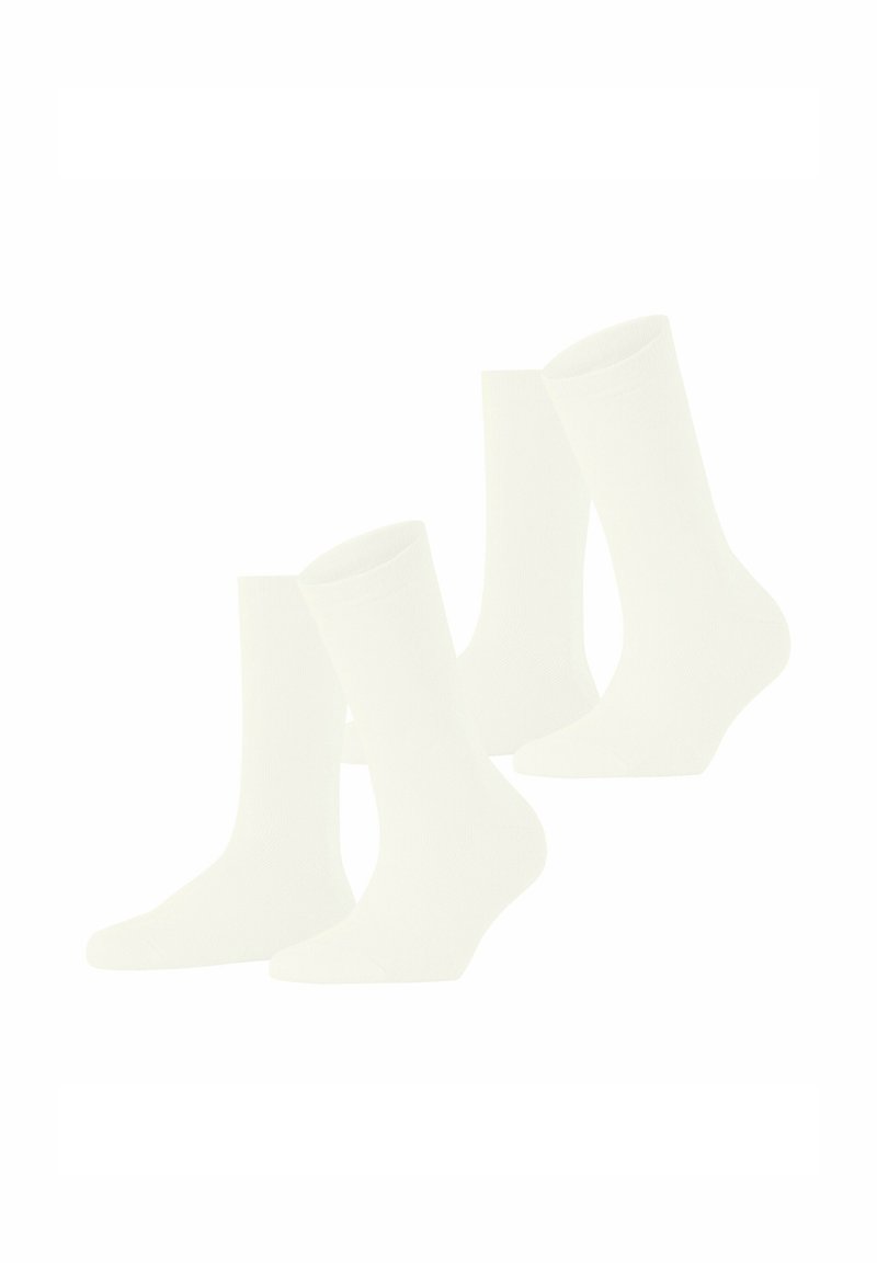 Vier paar witte sokken met een geribbelde textuur, halflange lengte, naadloze teen en elastische boord, ontworpen voor comfort en duurzaamheid.