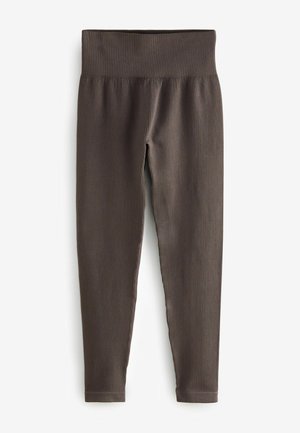 Leggings marron côtelés avec une large ceinture, design près du corps et coupe chevillée, fabriqués dans un matériau doux et extensible.