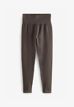 Leggings marroni a coste con una larga vita, design aderente e taglio lungo fino alla caviglia, realizzati in un materiale morbido e stretch.