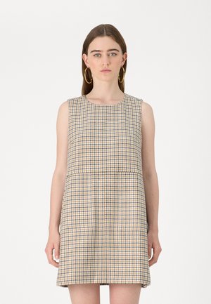 Ärmelloses Kleid in einem gelb-blauen und weißen Hahnentrittmuster. Gerader Schnitt, knielang, mit rundem Ausschnitt und strukturiertem Stoff.