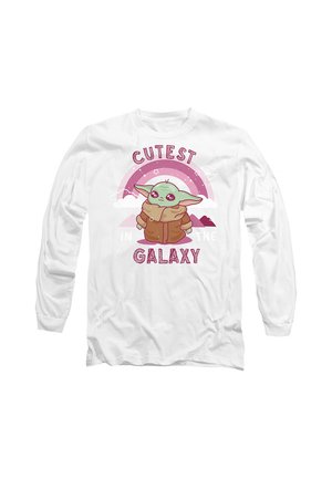 White long-sleeve shirt with a cartoon green character wearing a brown coat under a pink rainbow and the words "Cutest in the Galaxy."