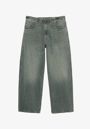 Lösa, blekta blå denimjeans med framfickor och justerbar dragsko i midjan.