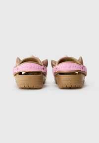 Pink and brown plastic sandals with cat ear accents, star-patterned straps, open back, and textured sole for grip.