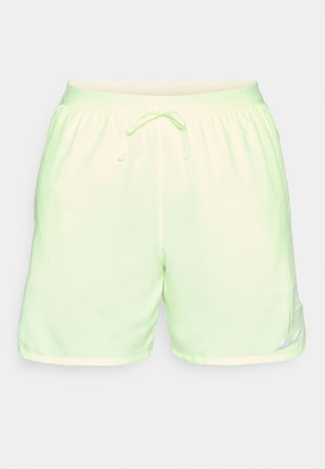 Light green running shorts with an elastic waistband and drawstring. Features a Nike logo on the lower right leg and smooth texture.