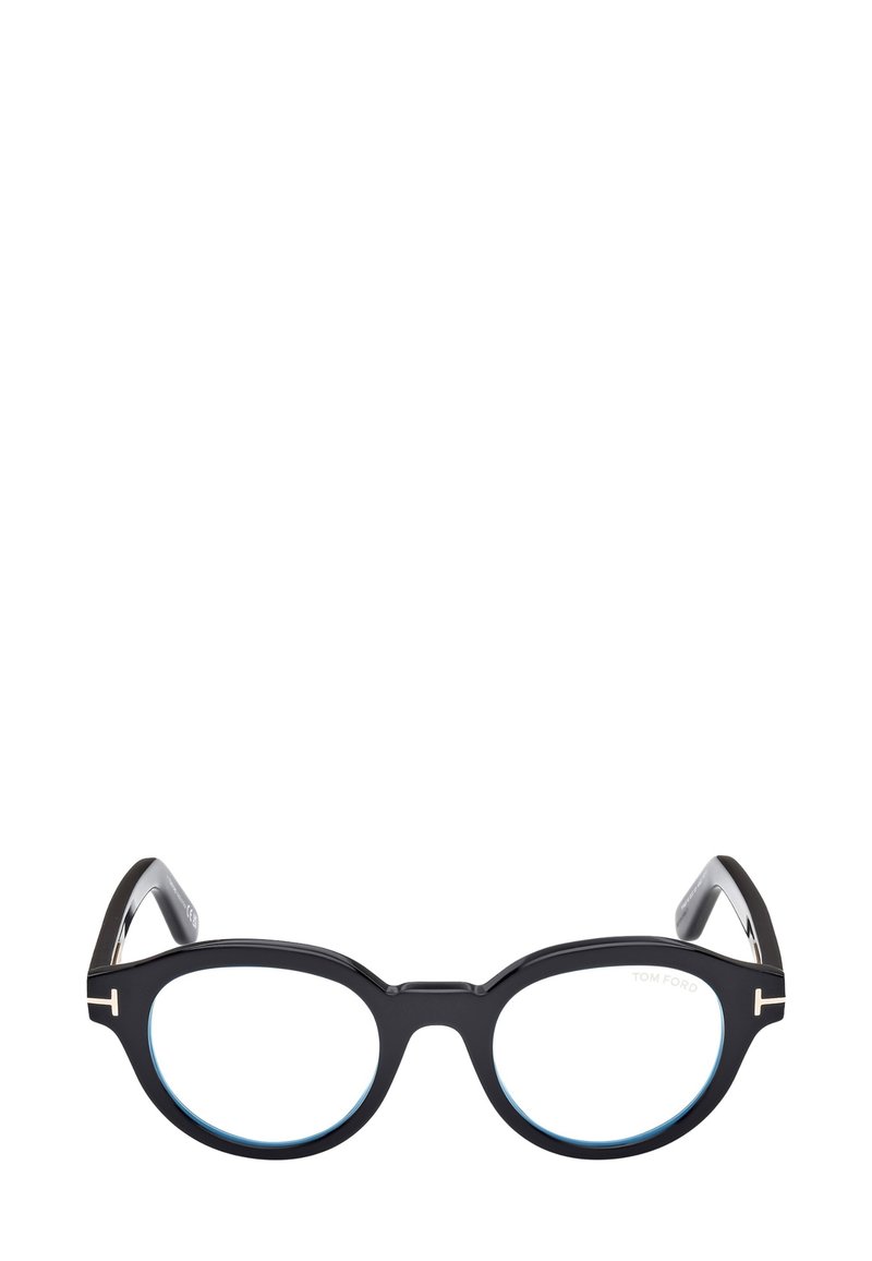 Occhiali in acetato nero con lenti rotonde, dettagli in azzurro chiaro e particolari in metallo sulle astine. Presentano una forma audace e unica.