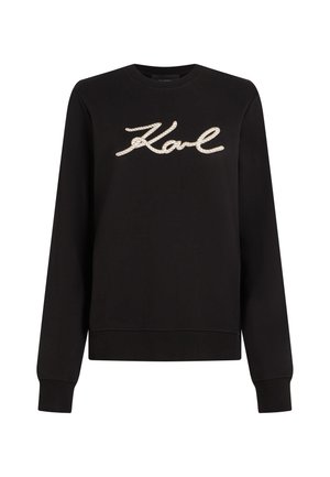 Μαύρο φούτερ με μακριά μανίκια και στρογγυλή λαιμόκοψη, με την επιγραφή "Karl" σε μπεζ στυλ σχοινιού στο στήθος.