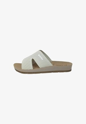 Sandaletto beige senza lacci con cinturini intrecciati in maglia e suola imbottita, progettato per un uso casual e il comfort.
