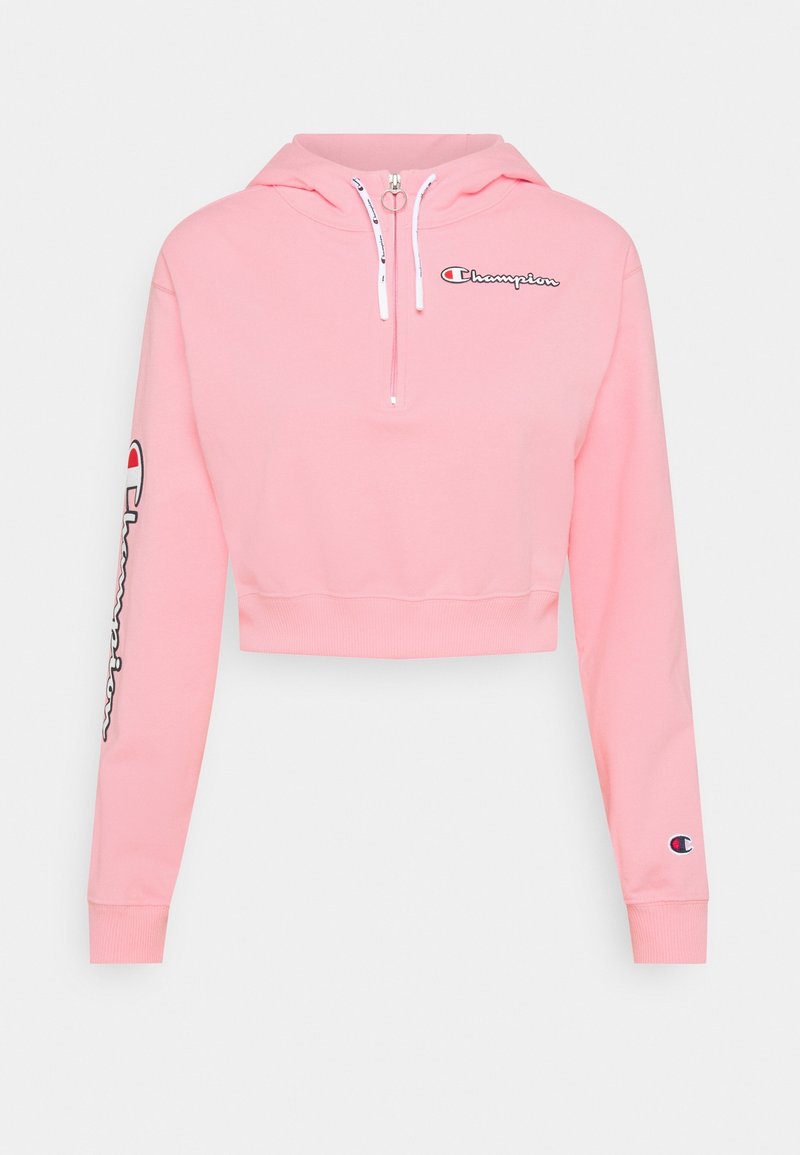 Kort rosa huvtröja i bomullsblandning, med kvartdragkedja, logotyp på bröstet och logotypdetalj på vänstra ärmen. Mjuk textur och åtsittande design.