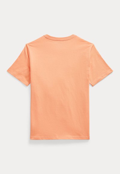 Κοντομάνικο t-shirt από βαμβάκι σε ανοιχτό ροδακινί χρώμα. Διαθέτει στρογγυλή λαιμόκοψη και απλή πλάτη με απαλή, λεία υφή. Χωρίς σχέδια ή διακοσμητικά στοιχεία.