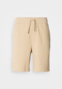 DAYONO - Tracksuit bottoms - medium beige