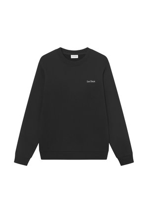 Zwarte katoenen sweatshirt met een ronde hals en lange mouwen. Heeft witte tekst "Les Deux" op de linkerkant van de borst. Gladde textuur.