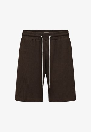 Mørkebrune shorts i teksturert stoff med elastisk midjebånd og lange hvite snorer, vist på en ensfarget hvit bakgrunn.