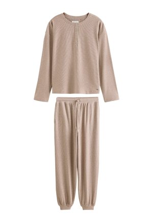 Beige long-sleeve henley top with buttons and matching drawstring jogger pants with elastic ankles, displayed on a white background.