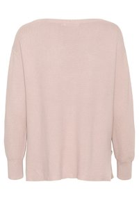 Ljusrosa stickad tröja, avslappnad passform, ribbad textur, vid båtutskärning, långa ärmar, sidofickor vid fållen för enkel rörelse.