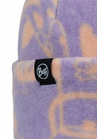 Purple fleece beanie with light orange abstract patterns. Features a black "Buff" logo tag on the rolled edge. Soft texture and versatile design.