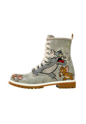 Gray leather ankle boot featuring cartoon graphics of Tom and Jerry, white laces, cushioned collar, and a tan rubber sole.