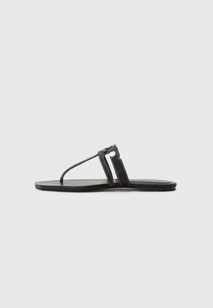 Black flat flip-flop with a thin strap design. Features a textured upper and a simple sole, minimalistic style with no embellishments.