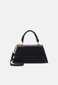 Black structured handbag with a smooth leather exterior, angled shape, top handle, and a detachable chain strap in gold hardware.