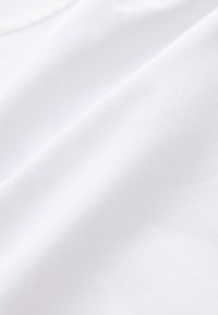 White fabric with a smooth texture, featuring a subtle sheen. The material appears lightweight and finely woven, displaying soft draping.