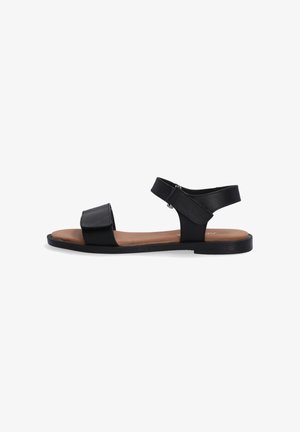 Schwarze Ledersandalen mit zwei Riemen, flacher Sohle und braunem Innenfutter. Sie verfügen über einen verstellbaren Knöchelriemen und ein minimalistisches Design.