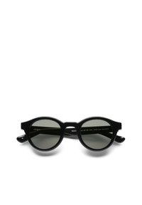 Pyöreät mustat aurinkolasit tummanharmailla linsseillä. Valmistettu bioasetaatista. Ominaisuuksiin kuuluu näyttävät kehykset ja kaarevat templet. Koko 46-26-145.