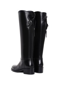 Black leather knee-high boots with a smooth finish, featuring a side zipper and adjustable strap details, sturdy block heels.