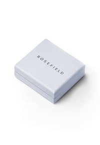 Svijetlo sivi kvadratni kutija s glatkom teksturom i poklopcem na šarke, s logotipom "ROSEFIELD" u crnoj boji na vrhu.