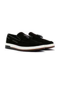 Black suede loafers with a smooth finish, featuring tassel accents, white and brown rubber sole, and side trim details.
